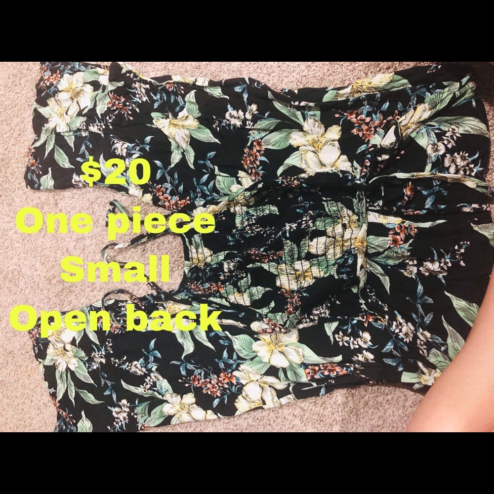 One piece. Open back. Jumpsuit